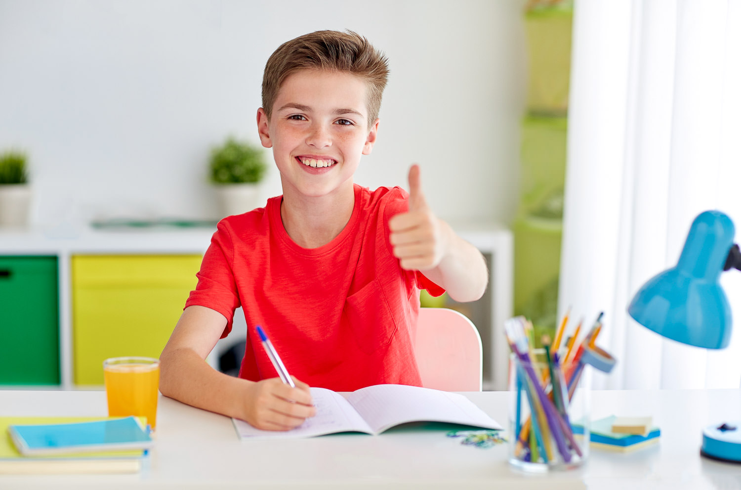 Boy smiling and enjoying dyslexia tuition